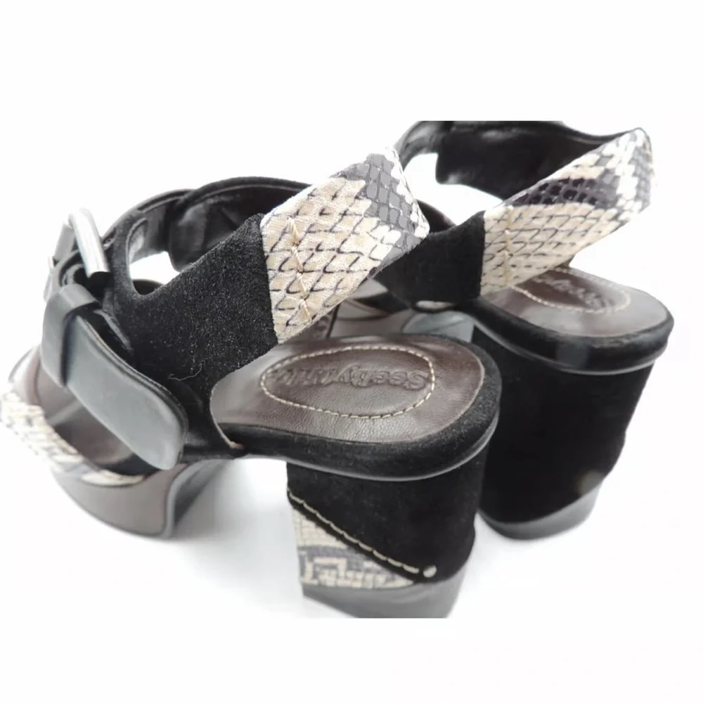 See by Chloe . Black , brown and python print platform heels.